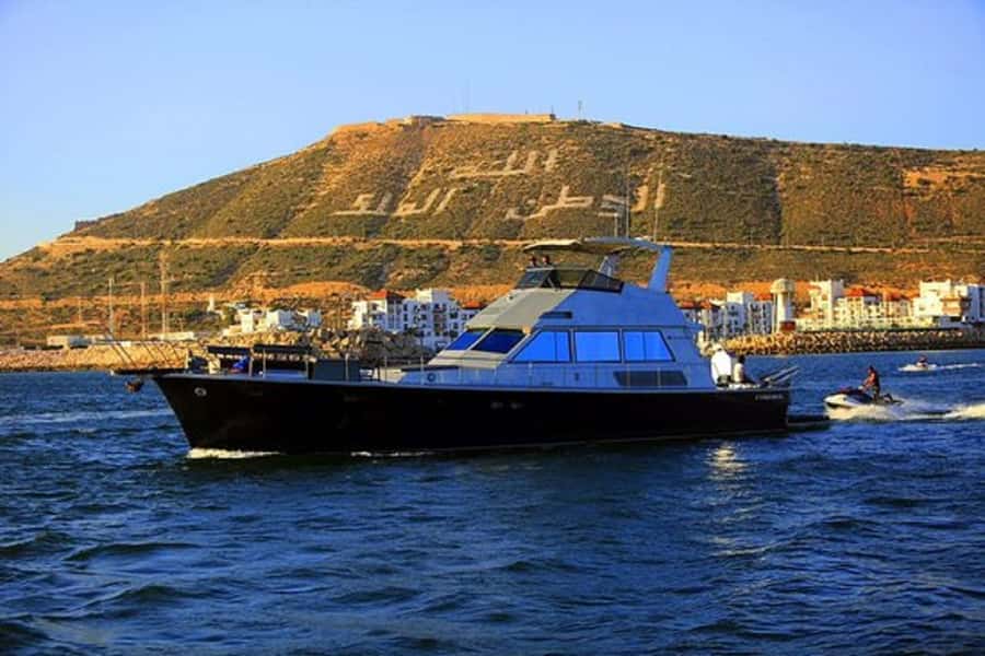 Agadir: Boat Trip with Fishing, Swimming, and BBQ Lunch - Coastal sailing with Agadir in view