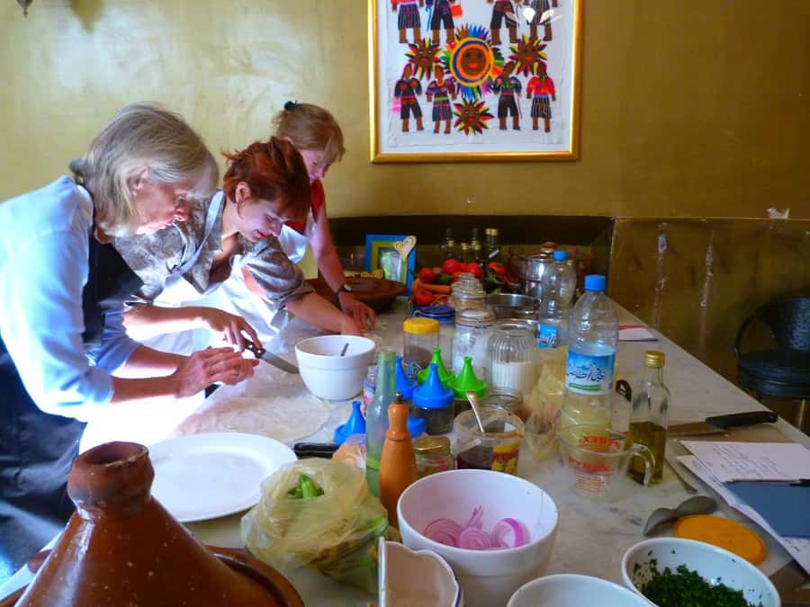 Edgy 8 Dish Private, Fusion Cooking Class, Menu Plan, Market - Writing an Arabic shopping list before entering the souk