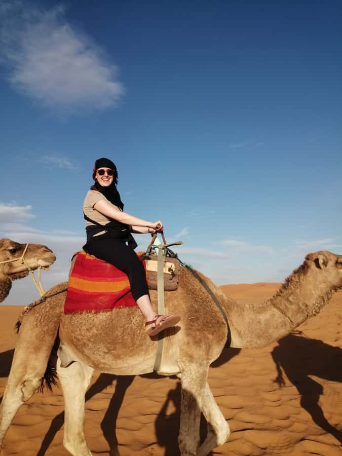 From Marrakech: Agafay Desert Sunset, Camel Ride, and Dinner - Riding a camel along the Berber path