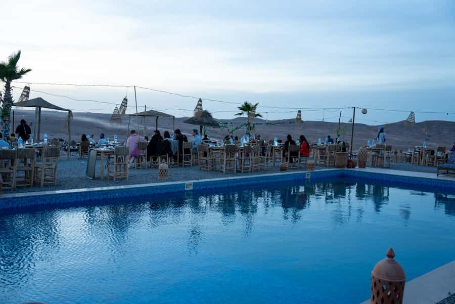 From Marrakech: Sunset Desert Tour with Camel Ride & Dinner - Crossing the stony desert by camel