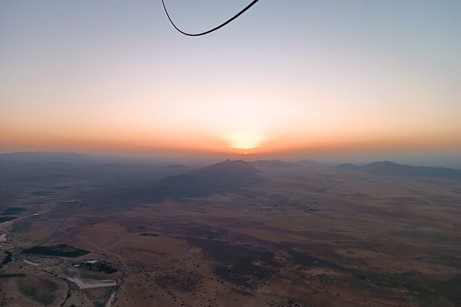 Hot air balloon flight to Marrakech in a small group. Breakfast - Watching the balloon inflate before takeoff