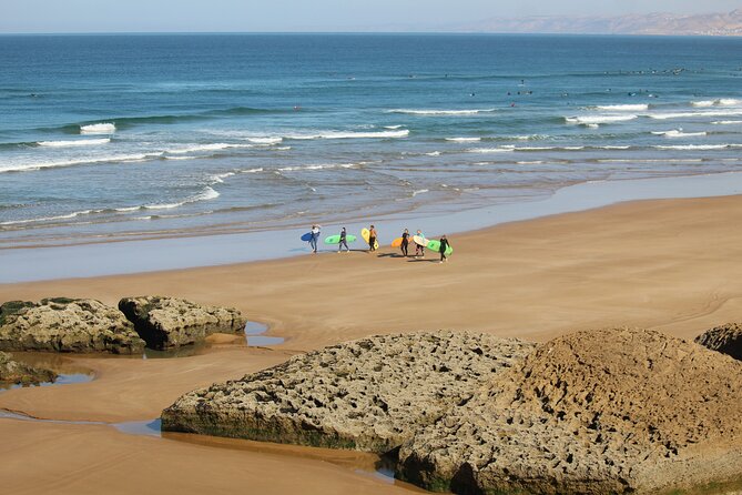 Learn to Surf with a Local - One Day Surf Experience - Getting into the water after the beach briefing