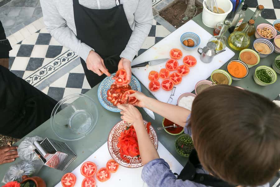 Marrakech: 3-Hour Open-Air Moroccan Cooking Course - Making tagine over the fire