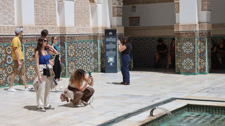 Marrakech: Ben Youssef Medersa, Le Jardin Secret & Souk Tour - Walking through the medina and its working souks