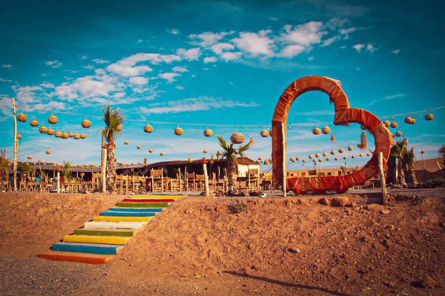 Marrakech: Camel Ride, Dinner, Pool, and Fire Show in Agafay - Mint tea and the camp after sunset