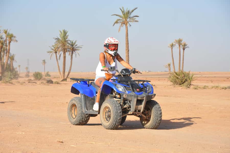 Marrakech: Desert and Palm Grove Quad Tour with Tea - Riding through rocky desert and palm trees