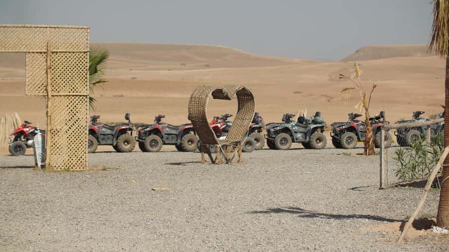 Marrakech Desert Sunset: Quad Biking, Dinner & Fire Show - Moroccan dinner beneath the evening sky