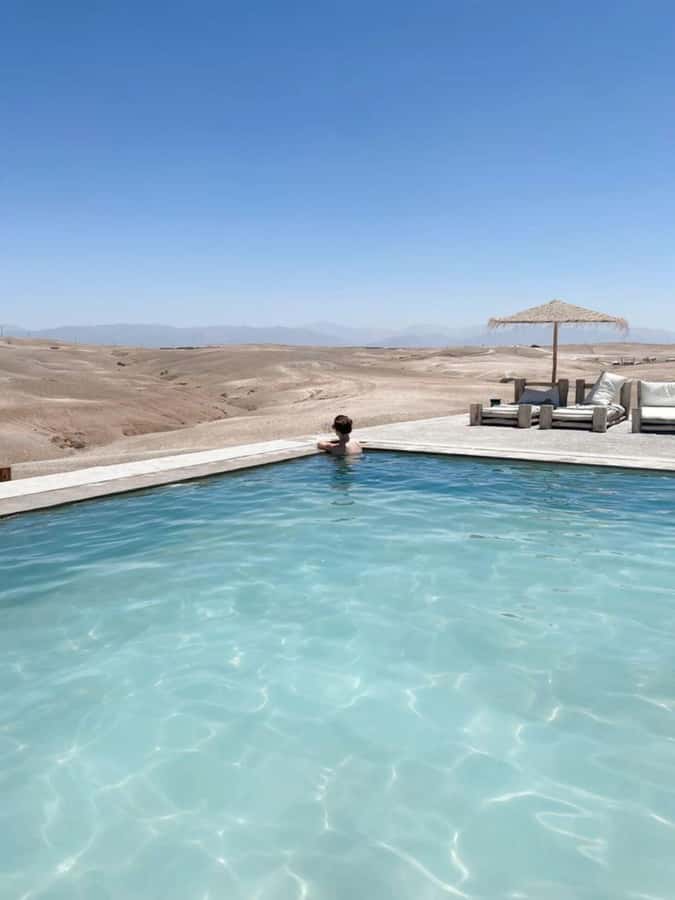 Marrakech: Full-Day Camel Ride, Quad Bike, & Spa Tour - Riding a camel across the rocky desert