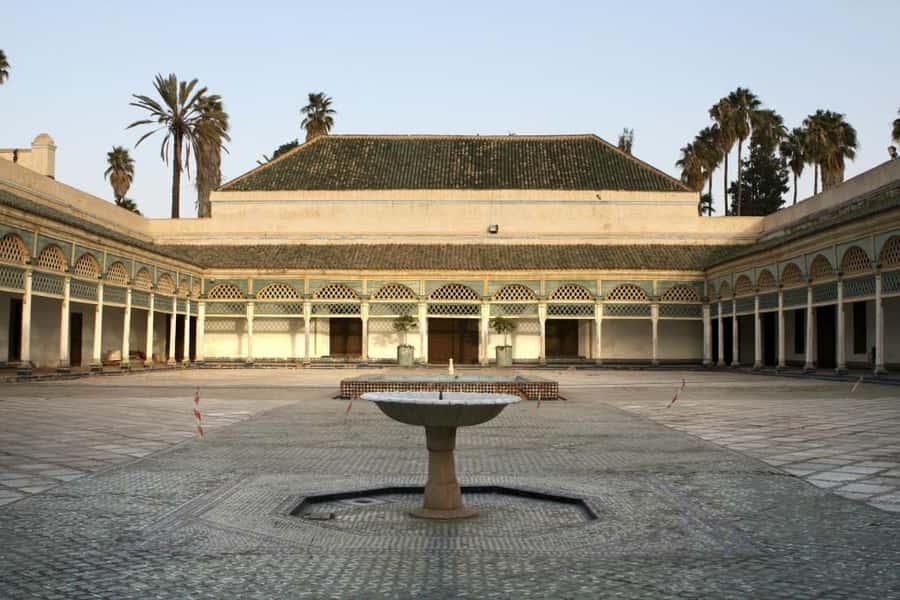 Marrakech Full-Day Guided Tour with Lunch - Menara Gardens and views toward the Atlas Mountains
