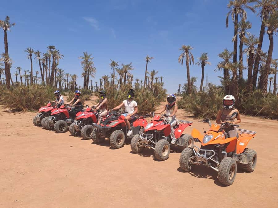 Marrakech: Guided Quad Bike and Camel Ride Tour with Tea - Camel riding with scarves and djellabas