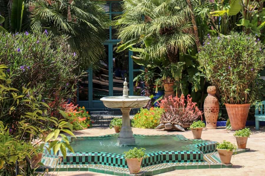 Marrakech: Majorelle Garden, YSL, and Berber Museum Entry - Shops and cafés add time to the visit