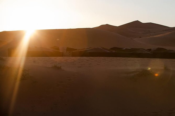 shared group Fez To Fez via Merzouga Desert Tour 2 Days/ 1 Night - Dinner, the fire pit, and a standard camp night